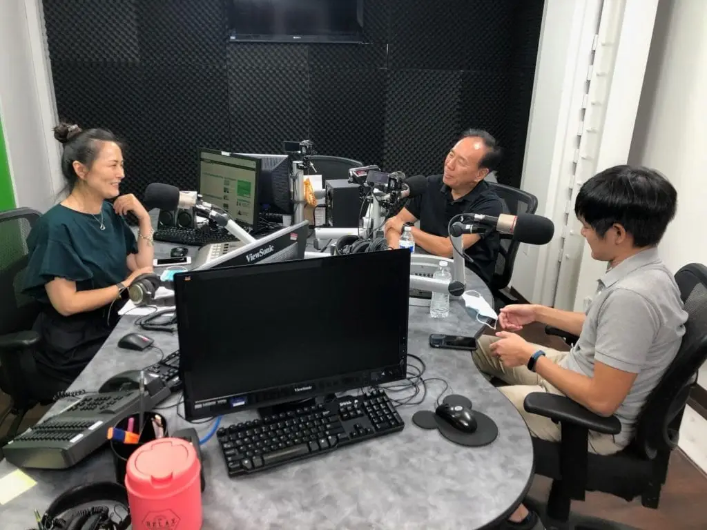 Team members working together at computers in an office
