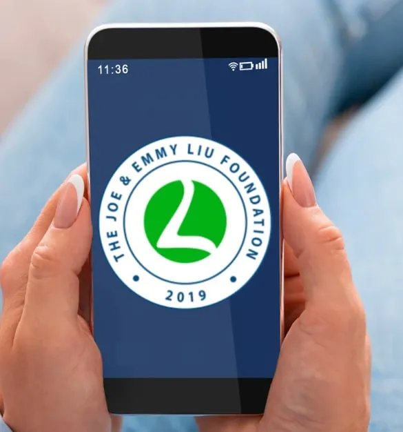 Hands holding a phone that shows the Joe & Emmy Liu Foundation seal