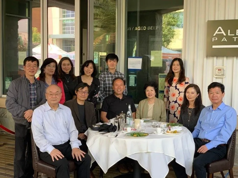 The Liu Foundation team gathered around a dinner table